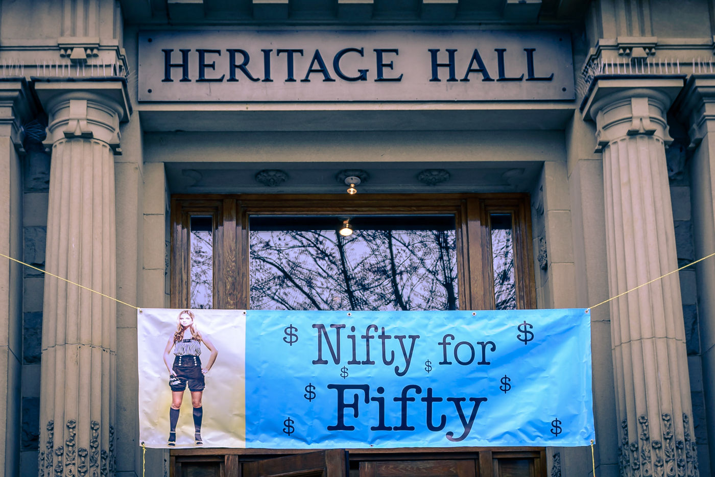 The big blue Nifty for Fifty banner hung across the doors of Heritage Hall.